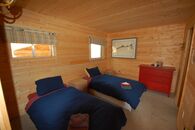 Bedroom at the Duplex Cabin One of the bedrooms at our Alaska fly fishing lodge